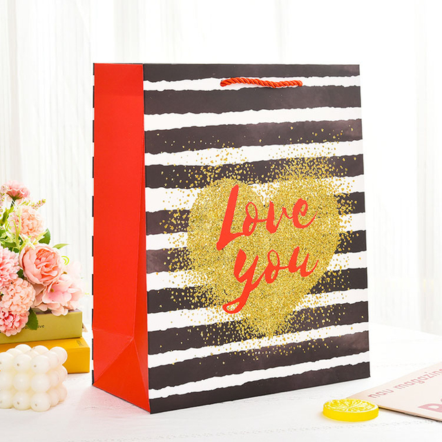 العلامة التجارية الفاخرة مخصصة الشعار حقيبة ورق للملابس الوردي غير اللامع ملابس ملابس البوتيك بوتيك مع مقابض الشريط